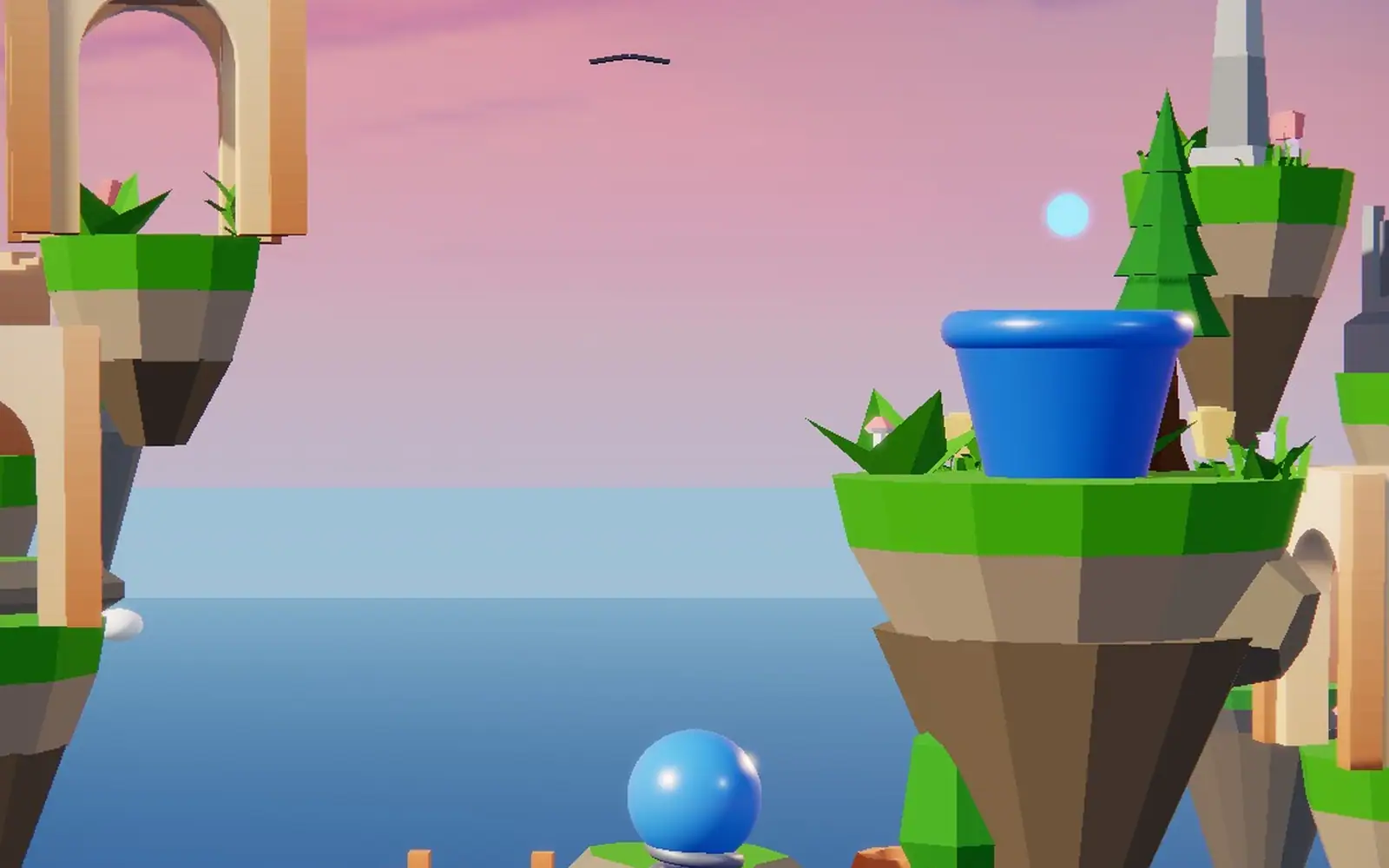 A ball at the foot of floating grass islands above a calm sea, a blue barrel on the ledge overhead.