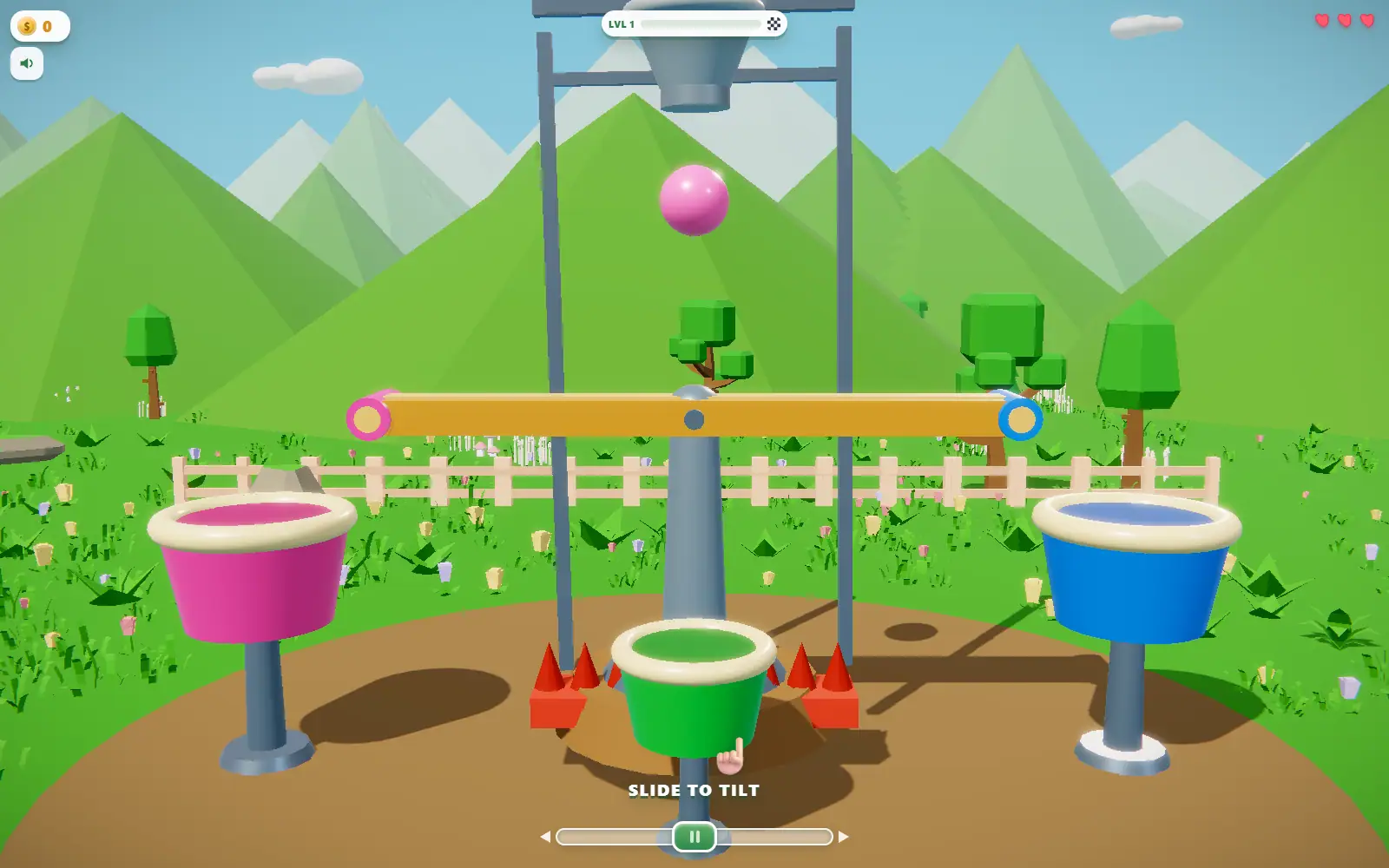 A pink ball dropping toward a tilting beam set above three coloured buckets.